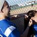 Lincoln players maintain each other's hair during a game against Skyline on Monday, May 6. Daniel Brenner I AnnArbor.com